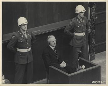 (WAR CRIMES--GERMANY) 13 photographs of the Nuremberg Trials, depicting Nazi defendents, including Hermann Göring and Rudolf Hess.